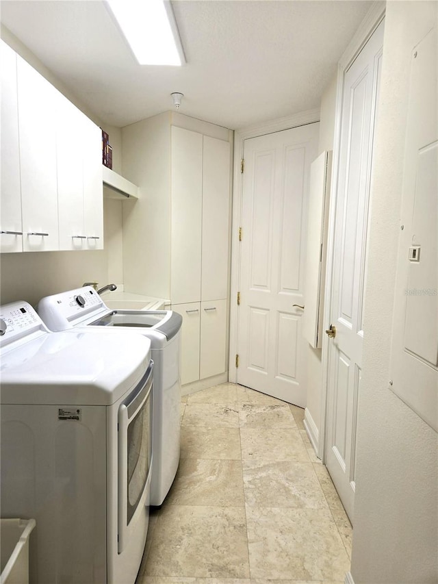 35 Watergate Dr Unit 1103, Sarasota, FL 34236 - washroom with cabinet space, washing machine and clothes dryer, and electric panel