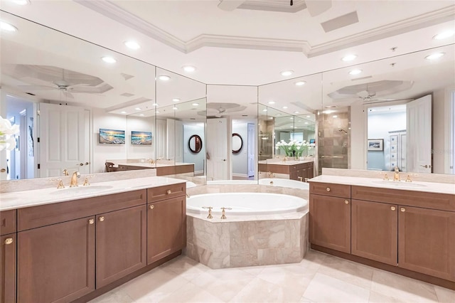 35 Watergate Dr Unit 1103, Sarasota, FL 34236 - bathroom featuring ceiling fan, ornamental molding, two vanities, a garden tub, and a shower stall