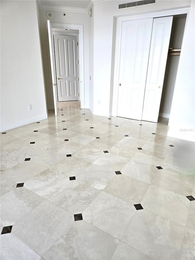 35 Watergate Dr Unit 1103, Sarasota, FL 34236 - unfurnished bedroom featuring crown molding and a closet