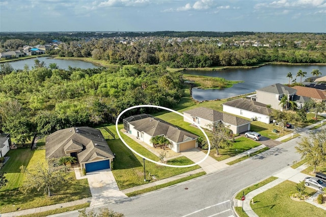 aerial view featuring a residential view and a water view