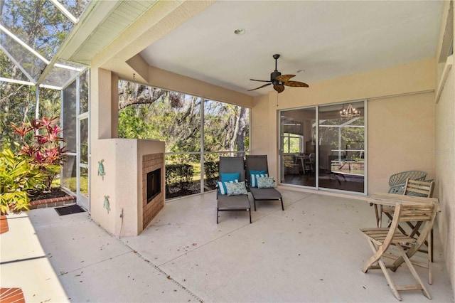 view of patio / terrace with a lanai and ceiling fan