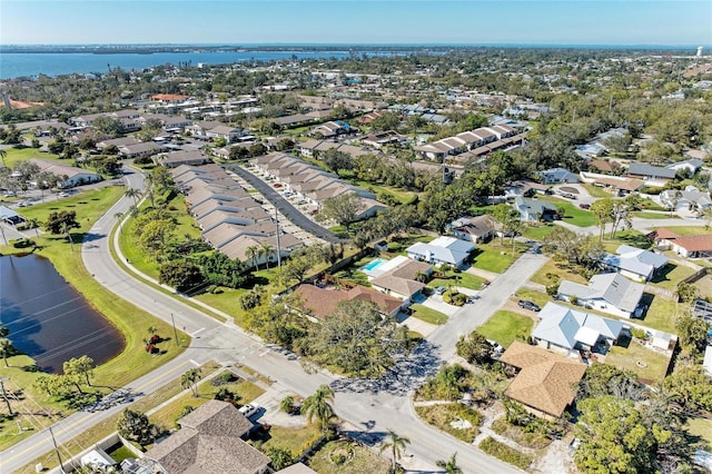 birds eye view of property featuring a residential view and a water view