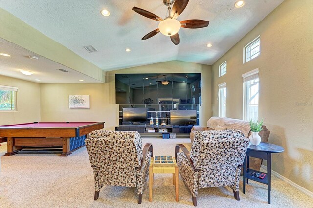 rec room featuring baseboards, lofted ceiling, carpet, and a textured ceiling