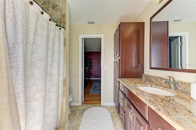 full bath with tile patterned flooring, visible vents, toilet, and vanity