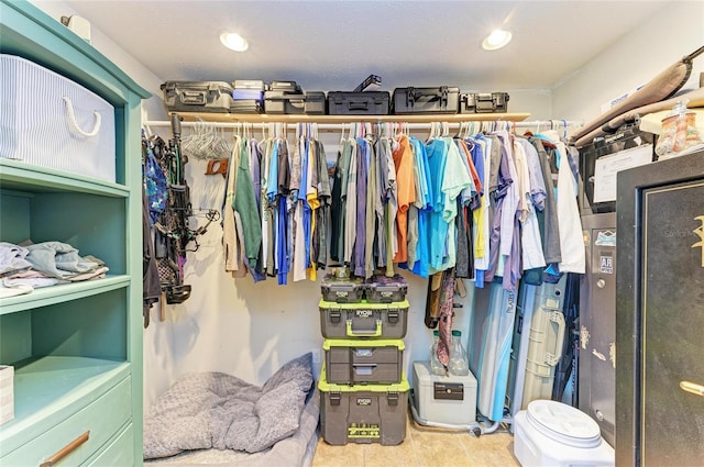 spacious closet featuring tile patterned floors