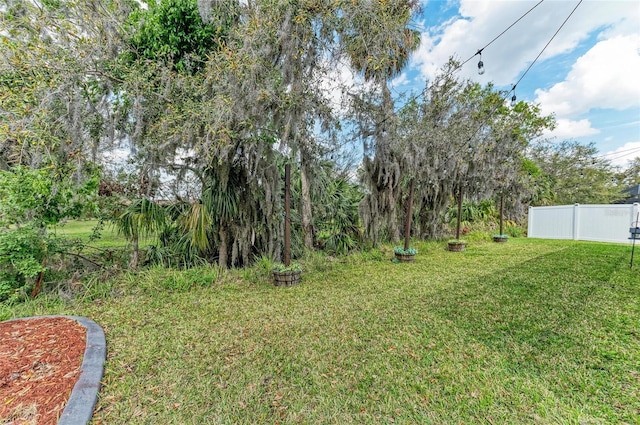 view of yard with fence