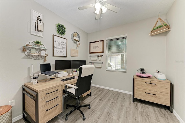 office with light wood finished floors, ceiling fan, and baseboards