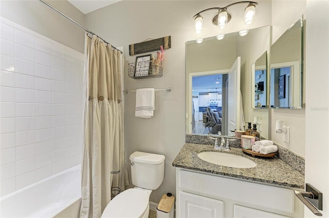 bathroom with shower / bath combo, vanity, and toilet