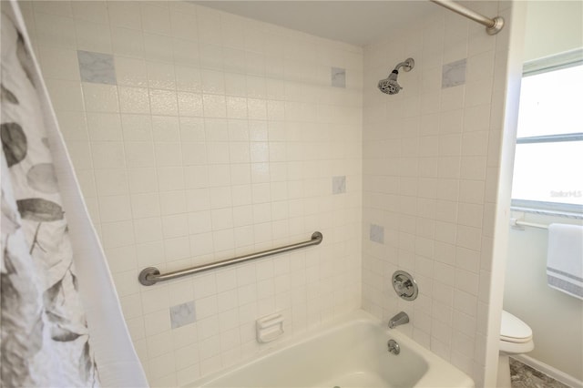 full bath featuring shower / bath combo with shower curtain and toilet