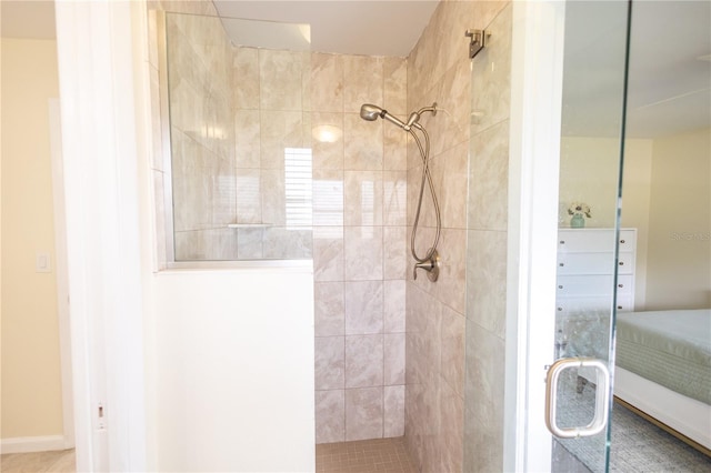 full bath with a tile shower and connected bathroom