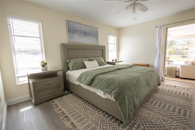 bedroom with baseboards, a ceiling fan, and light wood-style floors