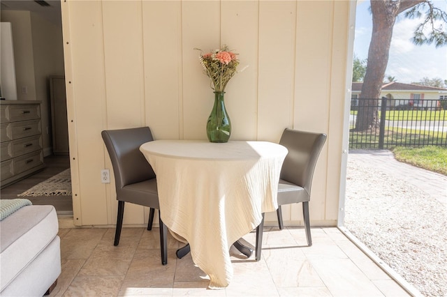 dining room with a decorative wall