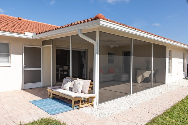 view of patio / terrace featuring a sunroom