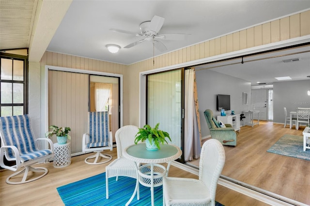 interior space featuring a ceiling fan and visible vents