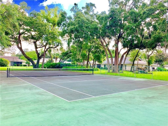 view of sport court with fence