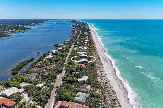 aerial view featuring a water view and a view of the beach