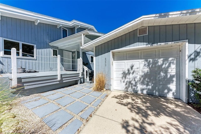 exterior space featuring driveway and an attached garage