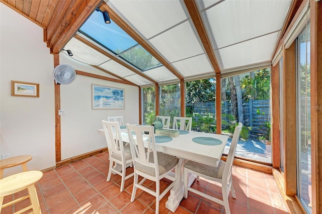 sunroom / solarium with lofted ceiling with beams