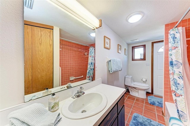 bathroom with visible vents, toilet, tile patterned floors, a textured ceiling, and vanity