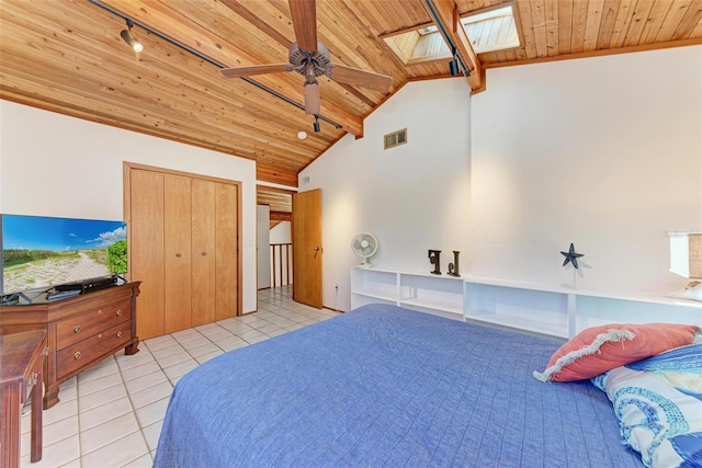 bedroom featuring a skylight, wood ceiling, visible vents, and tile patterned flooring