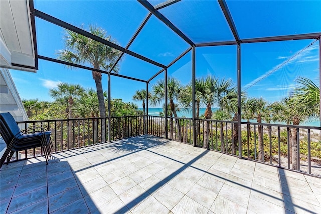 view of patio with glass enclosure