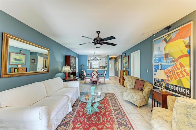 living room with light tile patterned floors and ceiling fan with notable chandelier