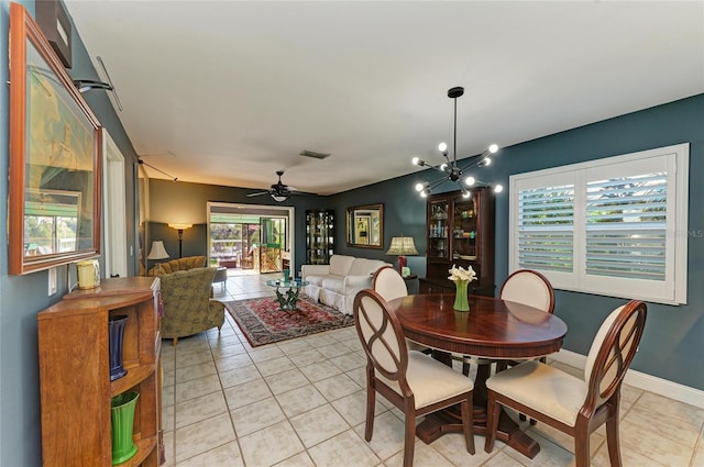 dining space featuring ceiling fan with notable chandelier, visible vents, baseboards, and light tile patterned flooring