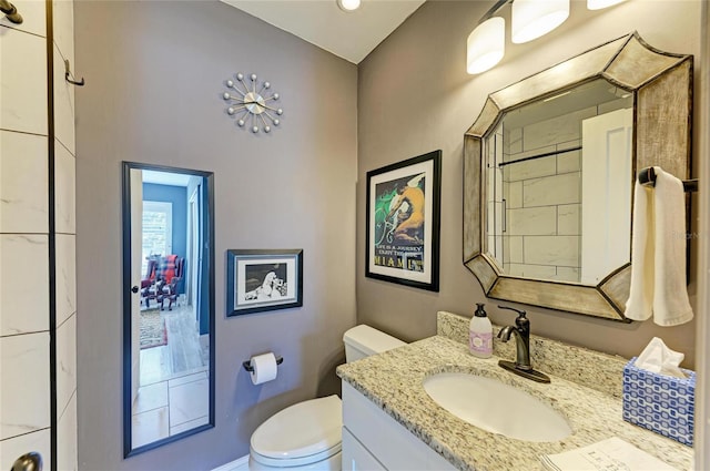 bathroom with toilet and vanity