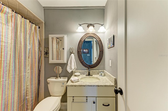 bathroom featuring a shower with curtain, vanity, and toilet