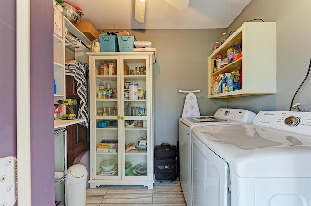 clothes washing area with laundry area, ceiling fan, and washer and dryer