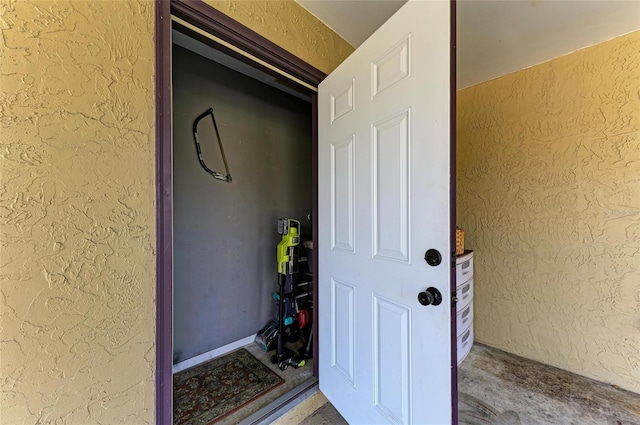 view of exterior entry with stucco siding