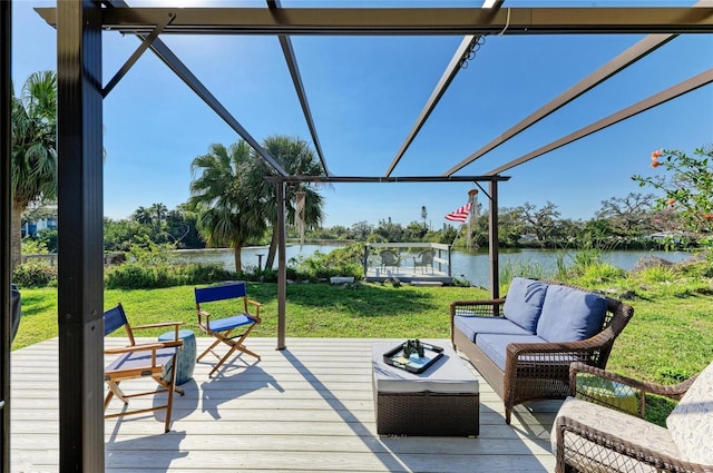 deck featuring a water view, a lawn, and an outdoor hangout area