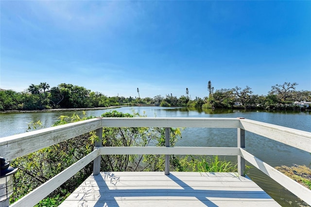 wooden deck with a water view