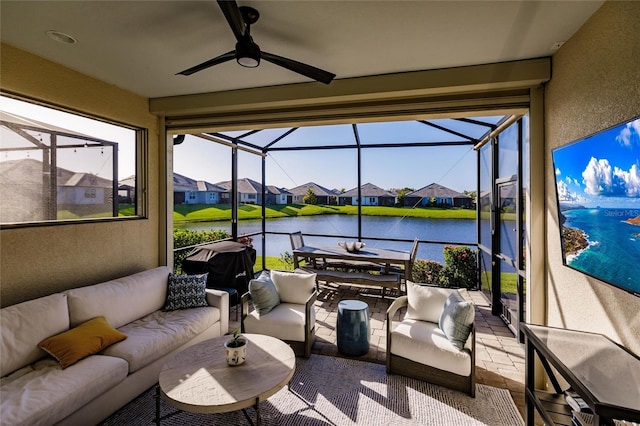 interior space featuring outdoor dining space, ceiling fan, a residential view, a lanai, and an outdoor living space