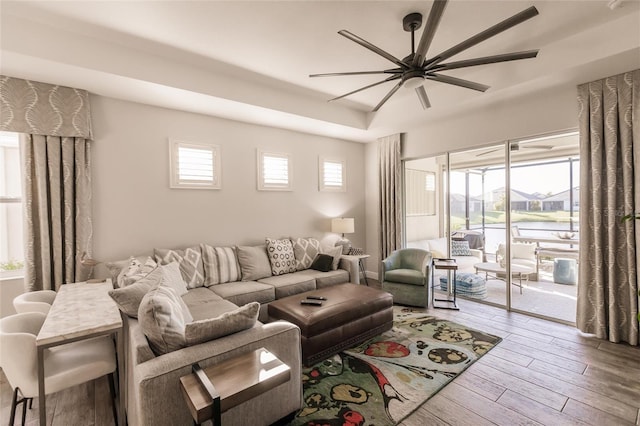 living area featuring ceiling fan and wood finished floors