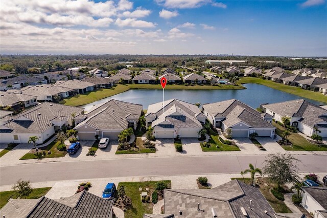 aerial view with a residential view and a water view