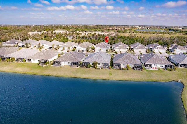 aerial view featuring a residential view and a water view