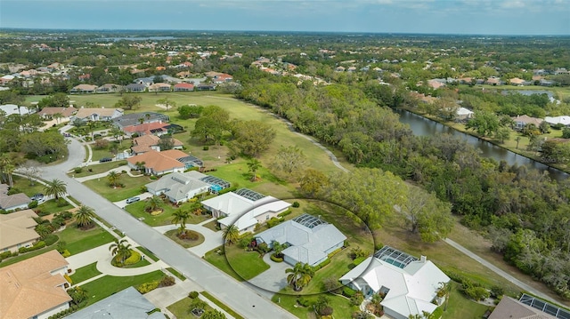 bird's eye view featuring a residential view and a water view