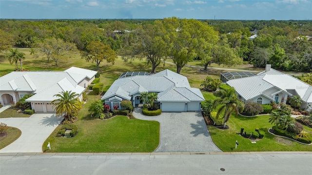 drone / aerial view with a view of trees