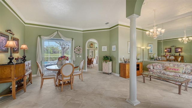 dining space featuring visible vents, ornamental molding, an inviting chandelier, decorative columns, and baseboards