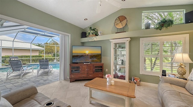 living area featuring plenty of natural light, high vaulted ceiling, ceiling fan, and a sunroom