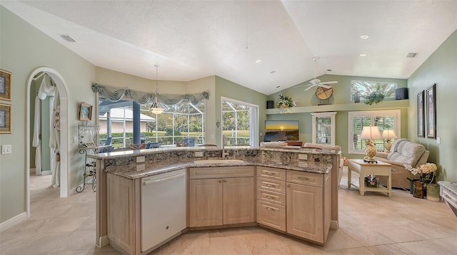 kitchen featuring visible vents, light brown cabinets, open floor plan, white dishwasher, and a ceiling fan