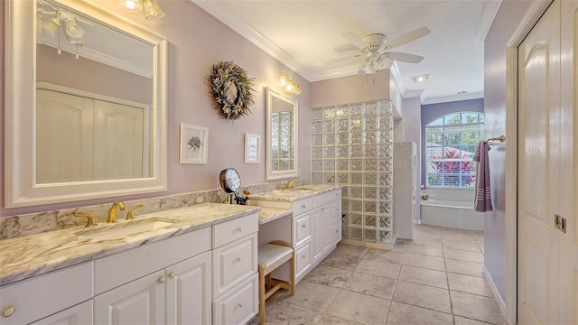 full bathroom featuring double vanity, ornamental molding, ceiling fan, and a sink