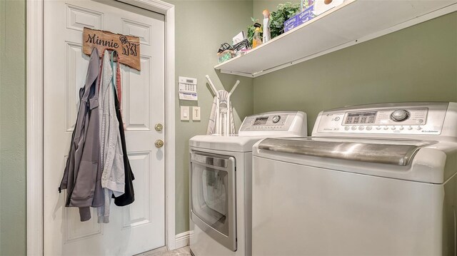 washroom featuring independent washer and dryer and laundry area