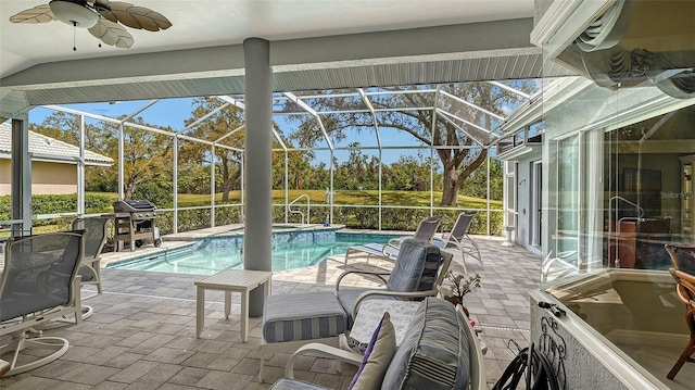 outdoor pool featuring a patio area, area for grilling, glass enclosure, and a ceiling fan