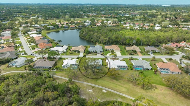 drone / aerial view with a residential view and a water view