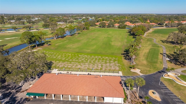 aerial view featuring a water view and golf course view