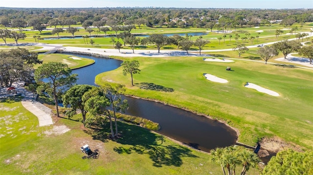 birds eye view of property featuring a water view and view of golf course