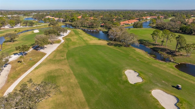 bird's eye view featuring a water view and view of golf course