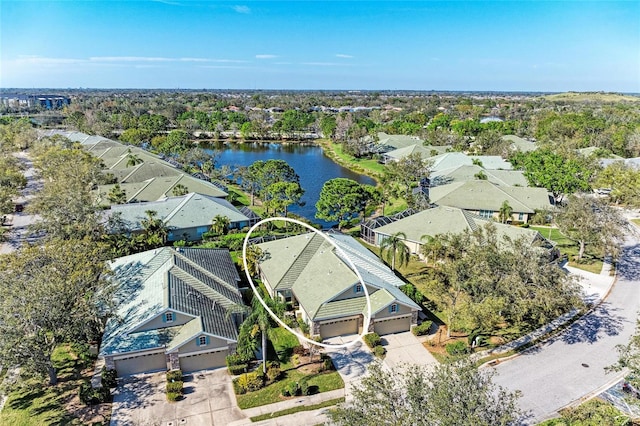 bird's eye view featuring a water view and a residential view